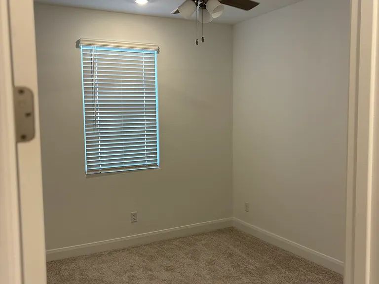 Each bedroom has a ceiling fan and a closet