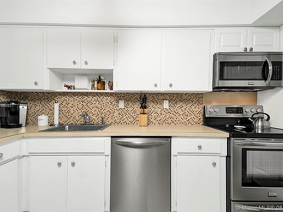 Ample and Functional Kitchen with Stainless Steel appliances