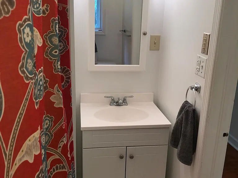 Vanity in bathroom; another vanity w/ sink also outside of bathroom.