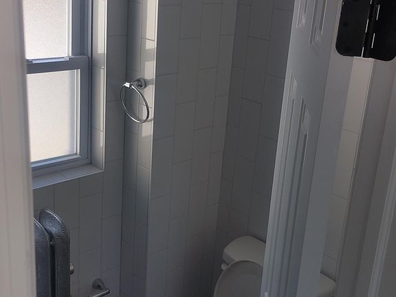 The right-hand side of the bathroom.