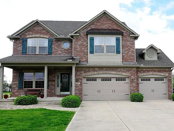 Beautifully landscaped home in Deer Creek with poured concrete landscape border.