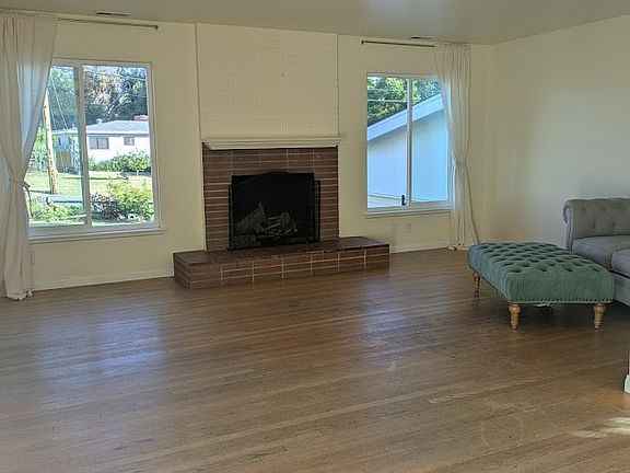 New windows and working wood fireplace in the living space.