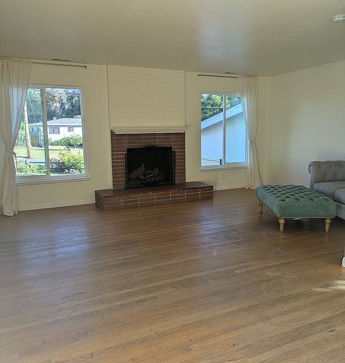 New windows and working wood fireplace in the living space.