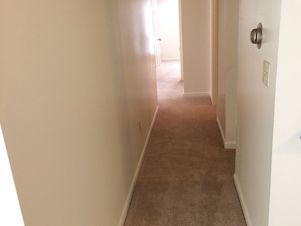 Hallway to 3 bedrooms & 2 full baths.