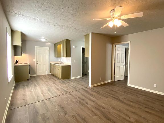 View from the front door: Living Room & Kitchen Brand new vinyl plank flooring throughout the home!