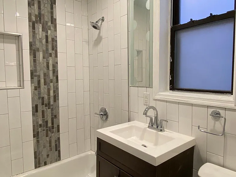 Brand new bathroom with new fixtures and tiles.