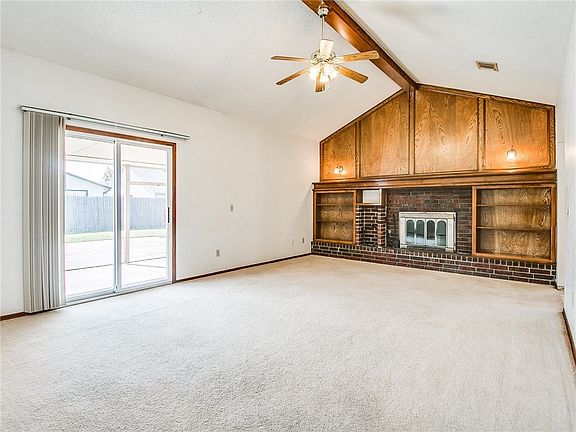 Beautiful woodwork in the living room with wood burning fireplace.