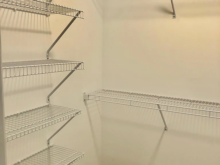 Master walk in closet with plenty of storage.