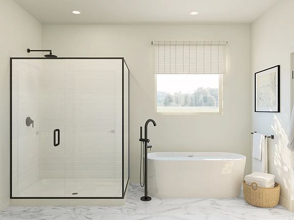 Primary bath with freestanding tub and glass shower enclosure