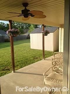 Covered Porch : Porch is perfect for spending time in the large backyard.