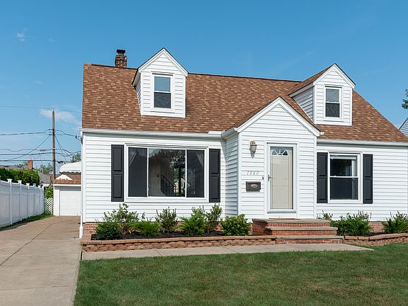 Long drive leading up to a two car, detached garage