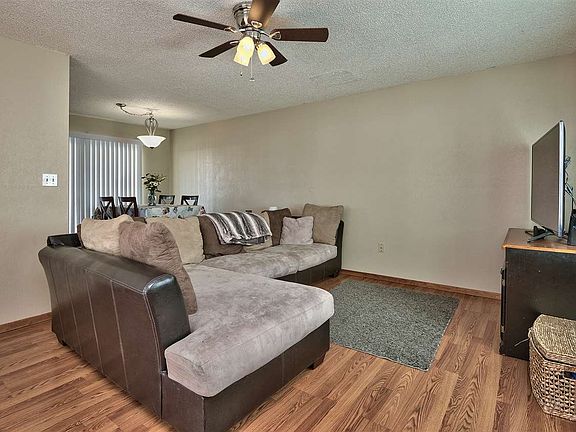 The main level offers living space; the master is on downstairs, and there are m