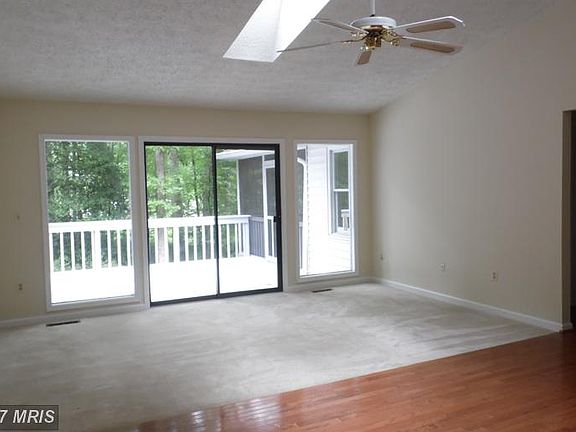Living Room with slider to deck and skylights