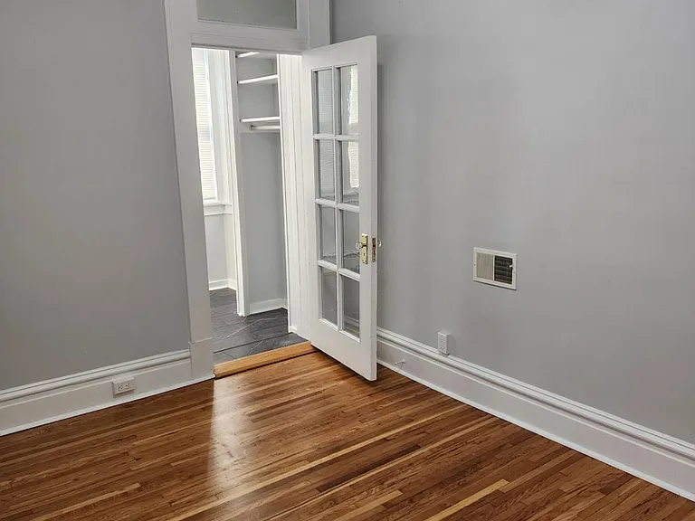 Bedroom looking into bonus Sun room off the bedroom could be used as small office or as large extra closet, etc.