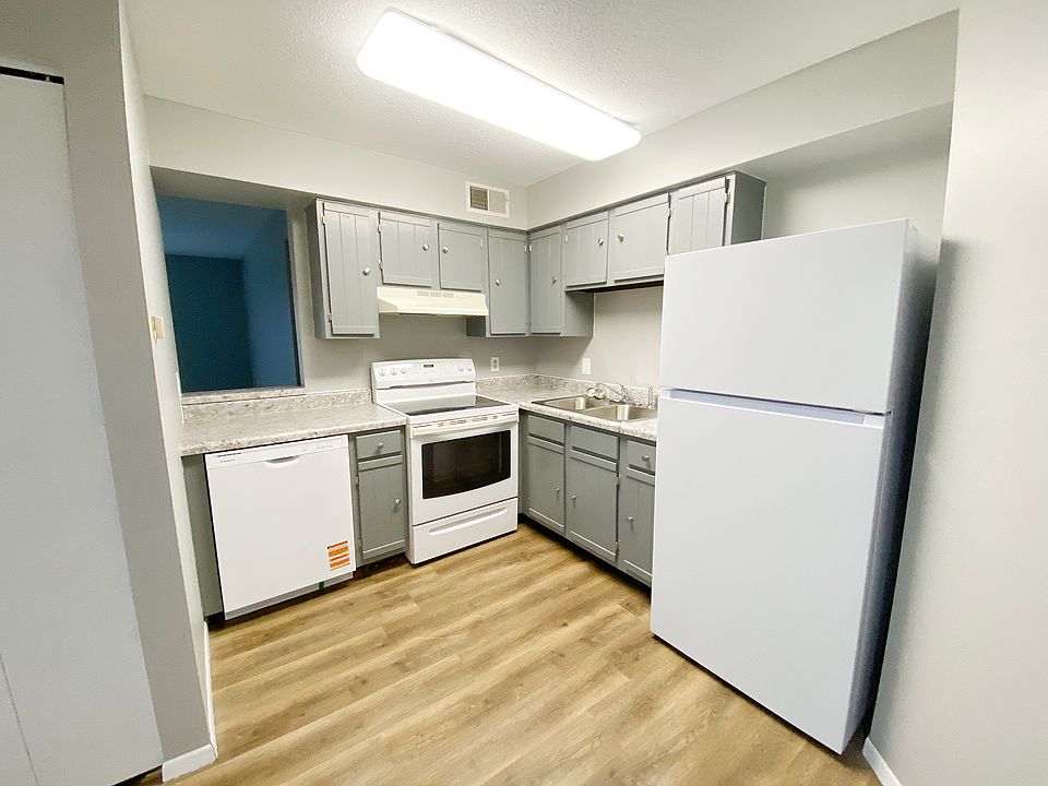 KITCHEN WITH FRESHLY PAINTED CABINETS ARE EURO GREY, NEW WHITE APPLICANCES; STOVE REFRIGERATOR AND DISHWASHER