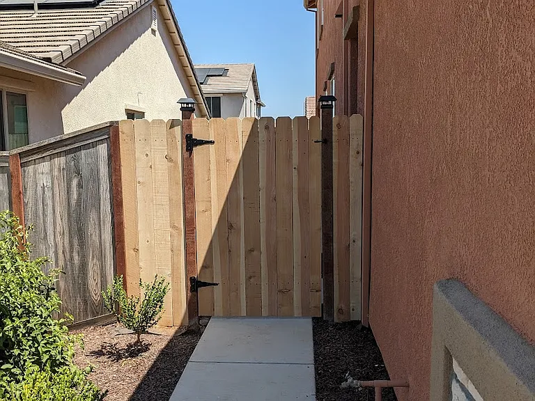 Your private, pet-friendly pathway leads to a peaceful low-maintenance side yard.