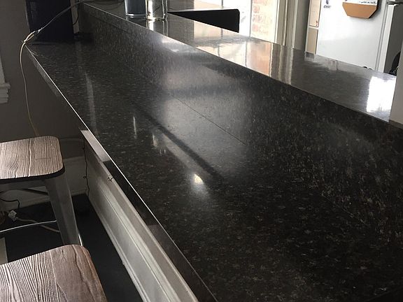 Bar in living room, looking into kitchen