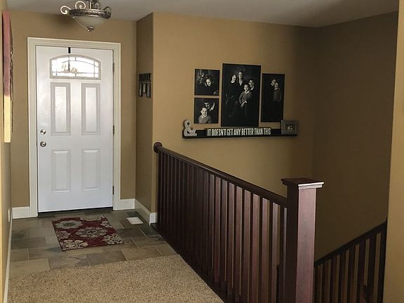 Entryway with open staircase