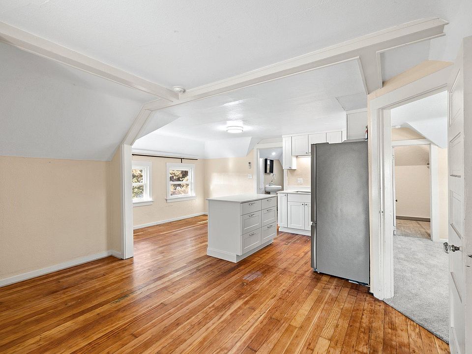 Living room into kitchen and North bedroom.