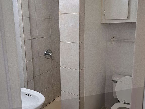 Bathroom with a shower stall.