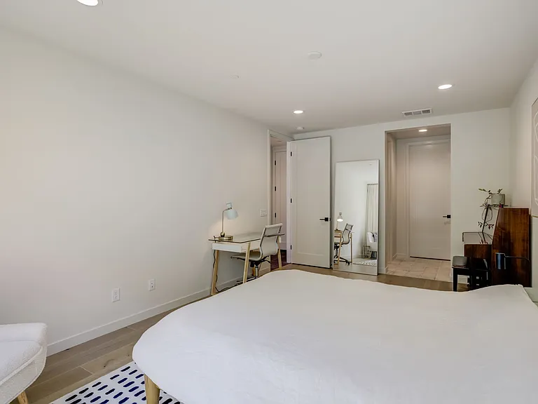 Private-entry guest suite featuring a kitchenette, walk-in closet, and full bathroom. A flexible space perfect for guests, multigenerational living, a home office, or creative studio.