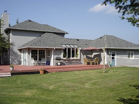huge deck wraps around 1/2 of the house