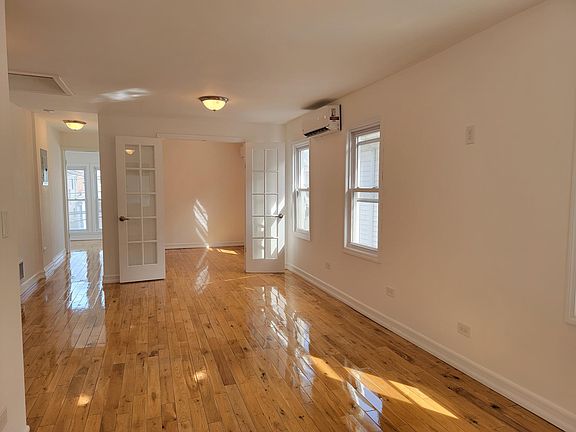 Newly Sanded and Poly Floors Throughout - Here's The Living Room Leading to Guest Bedroom
