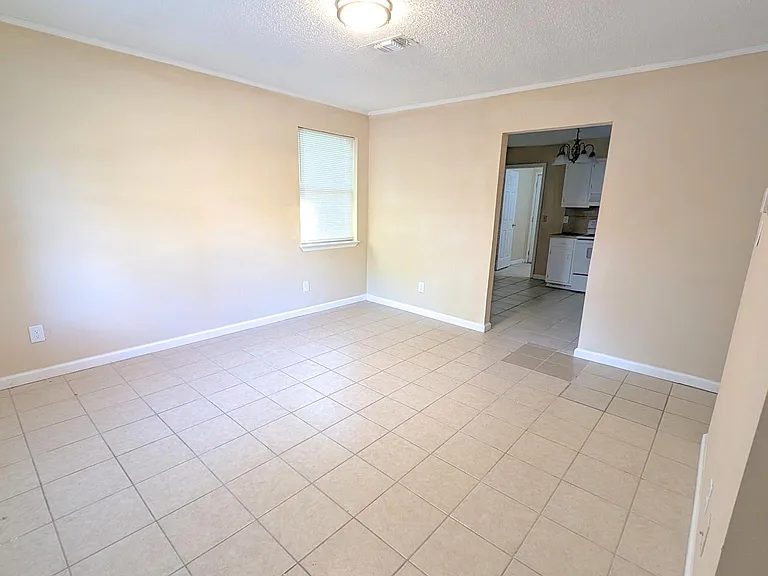 Spacious living room ready for your personal touch