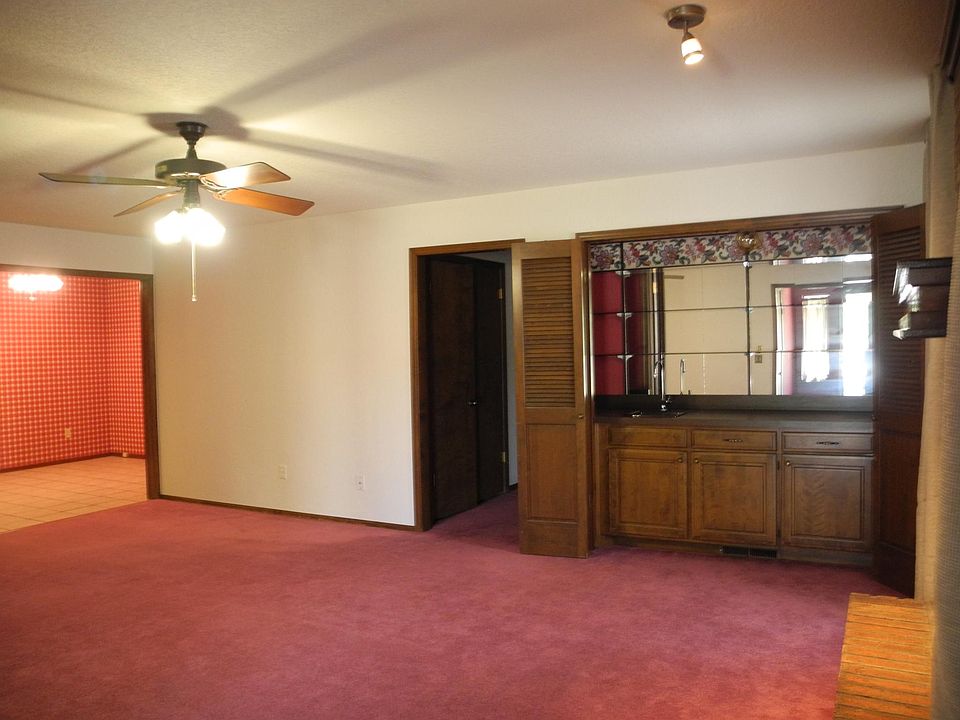 Front room leading down hallway to second bathroom and bedroom