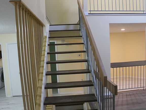 freshly stained stairs to loft and bedroom(s)