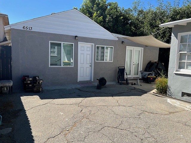 Front of Backhouse. Things laying around belong to current tenant. Will be free of clutter. Other Bldg in pic is 10' away from it and is the front house.