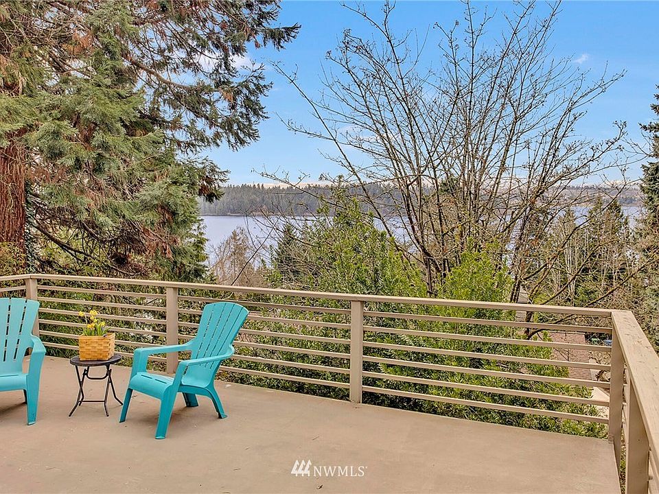 Partial western lake,city and mountain views from this mid century modern classic!