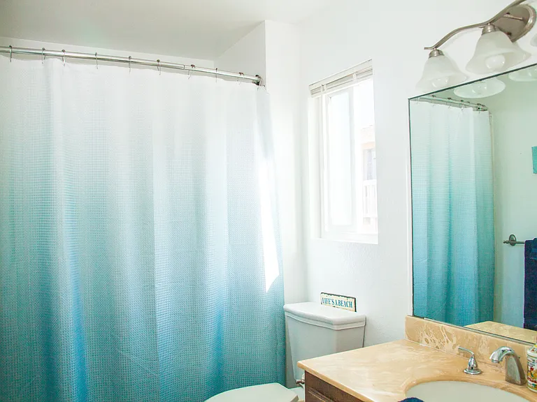 Full bathroom with shower and tub.