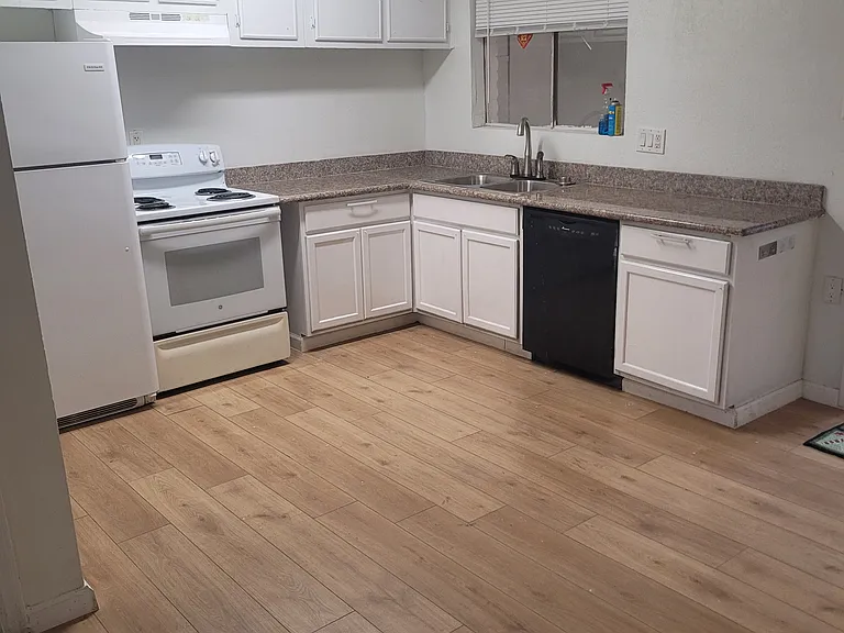 Kitchen area connected with dining space
(Dishwasher not included)