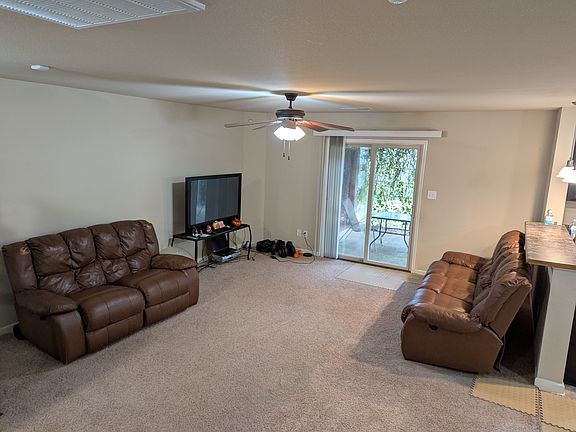 living room, glass sliding door out to the back pergola