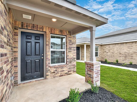 The Hawthorne has a charming covered front entryway.