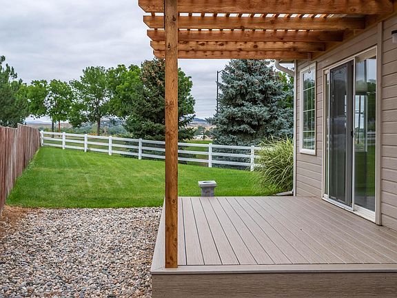 Gated back yard with beautiful lawn and views