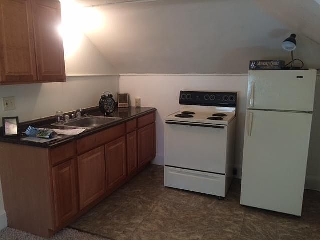 Kitchen with new flooring and cabinets.