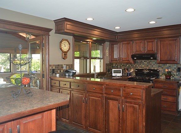 Custom kitchen with built in pub height breakfast bar!