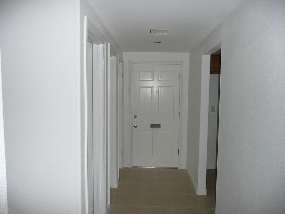 Entrance Hall View. Tile floor. Kitchen entrance on right.