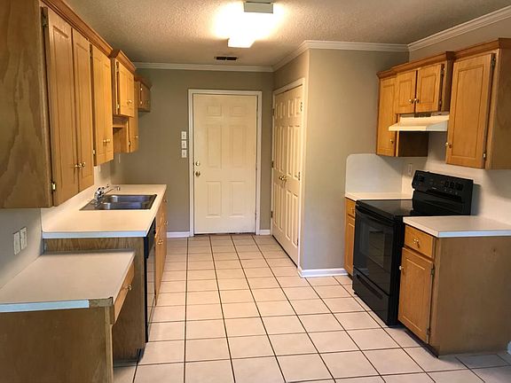 Kitchen from breakfast nook. Double doors to the right, washer/dryer hook up.