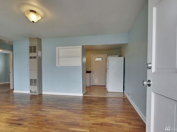 Entry opens to original hardwood floors!