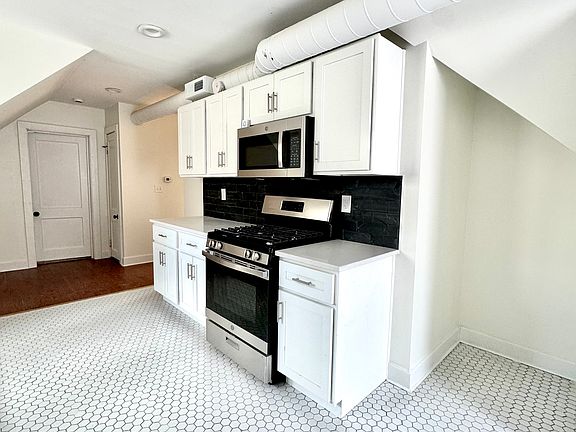 Additional cabinet storage, new appliances, gas oven/range & vented microwave!