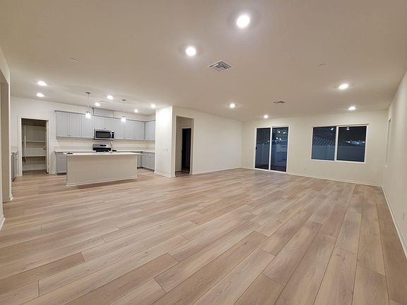 Large and open living space. Furniture will be added by the owner