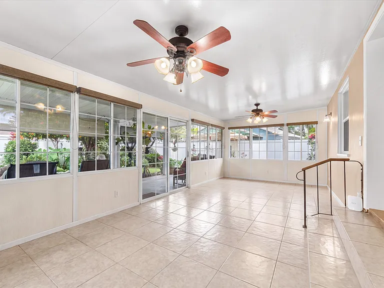 Sunroom in the back of the house looking out towards the backyard garden