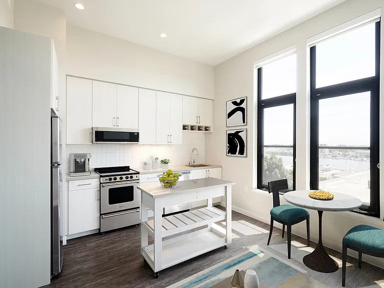 Stunning apartments with wood flooring, moveable island with storage, and stainless steel appliances.