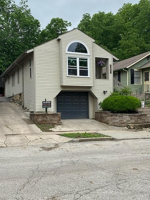 View of house from 46th Street - drive to left is shared up to back off street parking and patio.