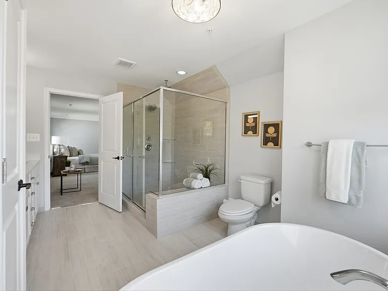 Beautiful en-suite with large shower, soaking tub, and double vanity.