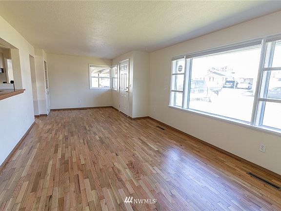 Entryway with built in hutch leading into the living room.