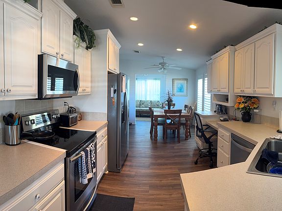 Home has a fantastic Kitchen with loads of cabinets, countertop space and all the appliances including a dishwasher.
